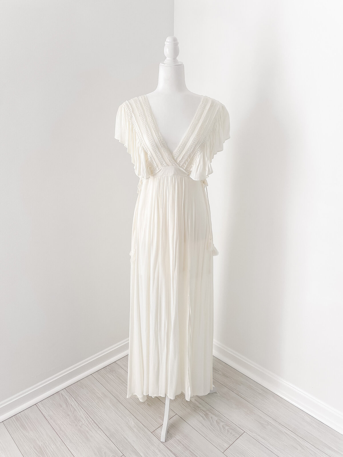 A cream midi dress with tassels and a v neck for your DC Newborn Photography photo session