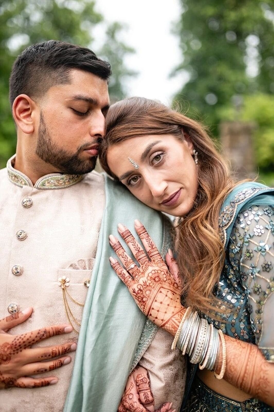 Stunning bride and groom in traditional Indian wedding attire