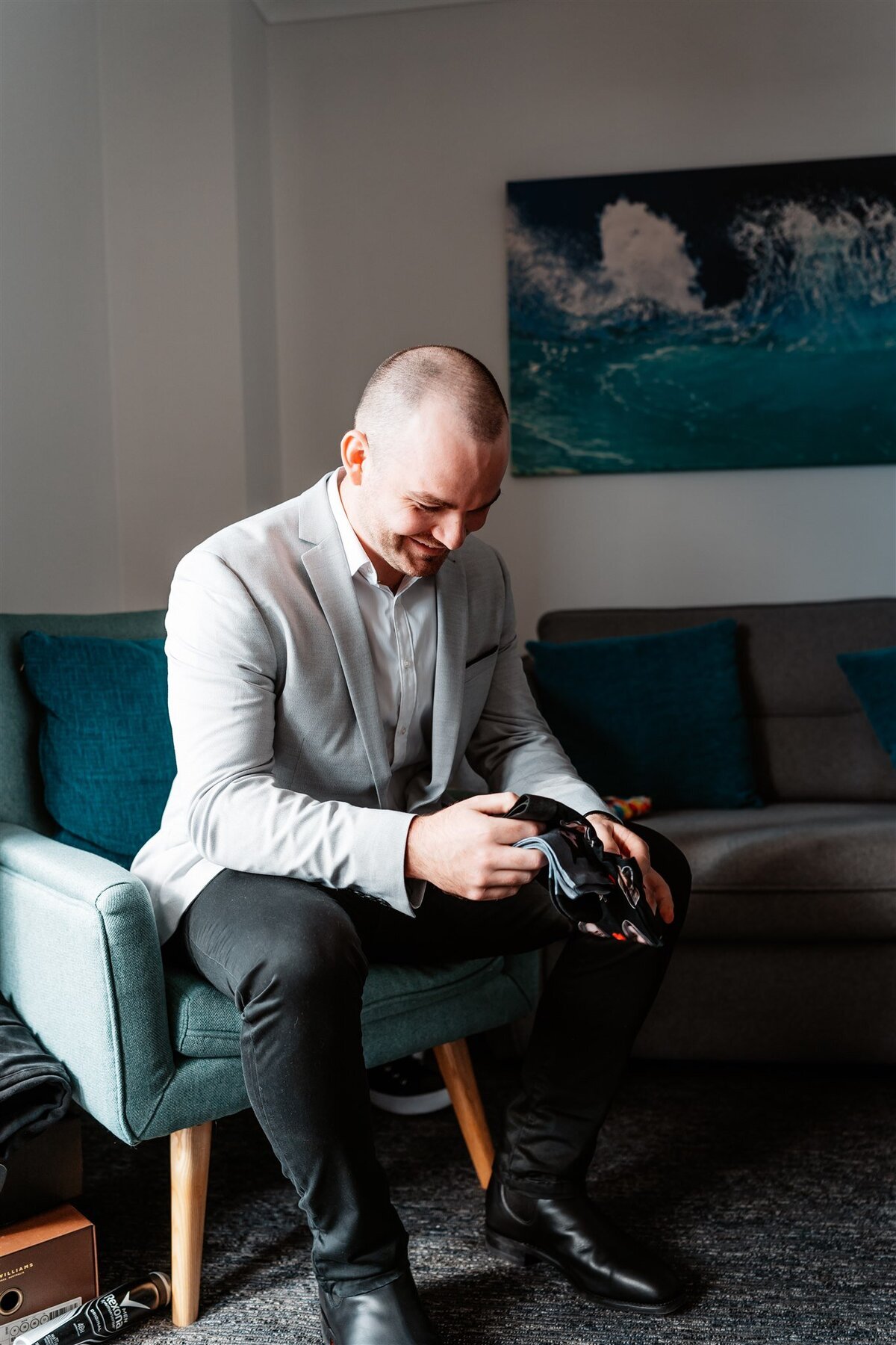 Cory checking his beautiful shoes before having his wedding ceremony