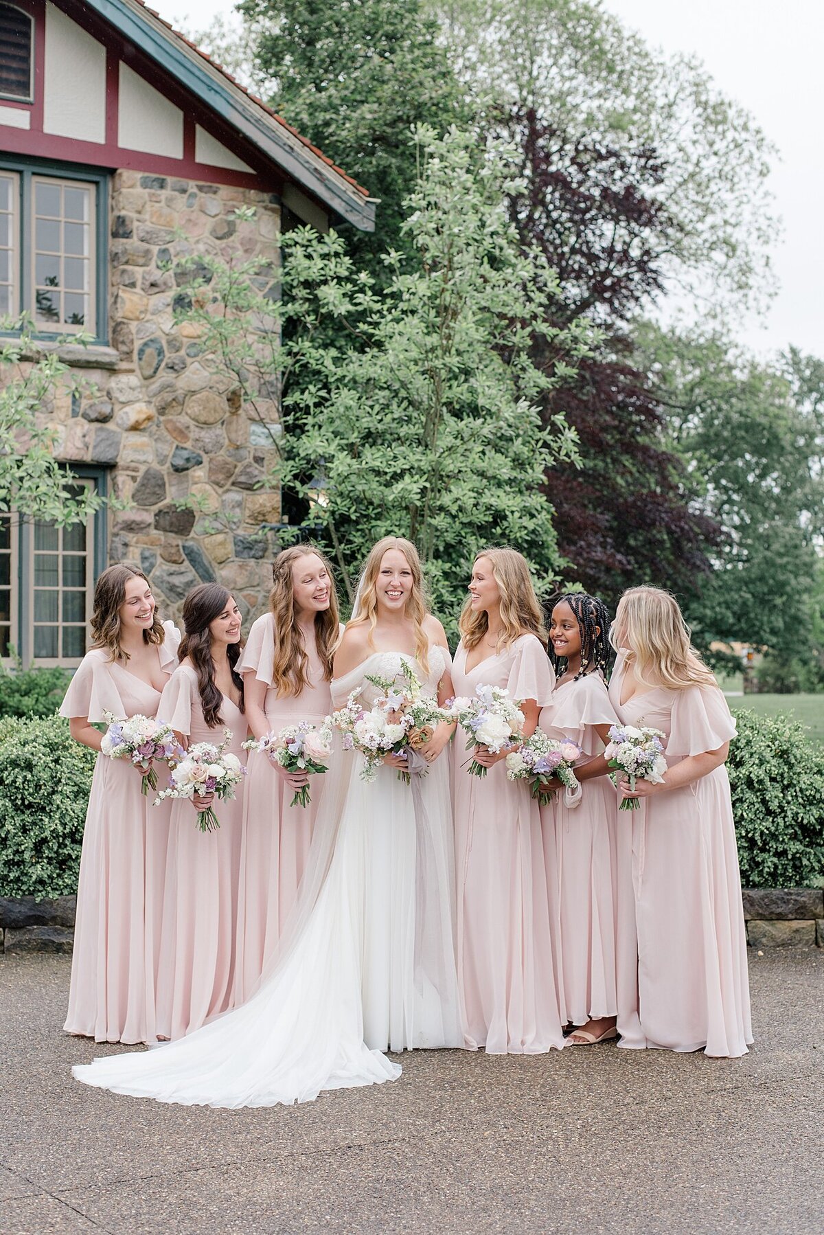 Bridesmaids in light pink dresses at beverly mansion in columbus, ohio