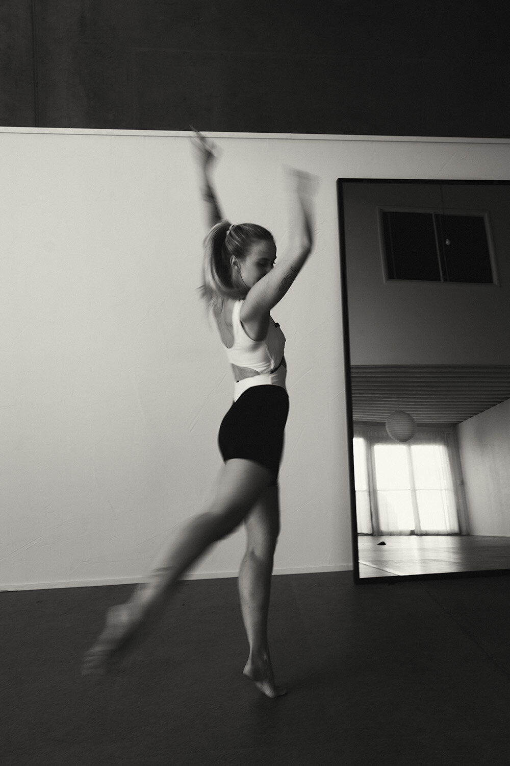 Sunshine Coast branding photographer captures graceful motion in a bright, open dance space — energy in motion.