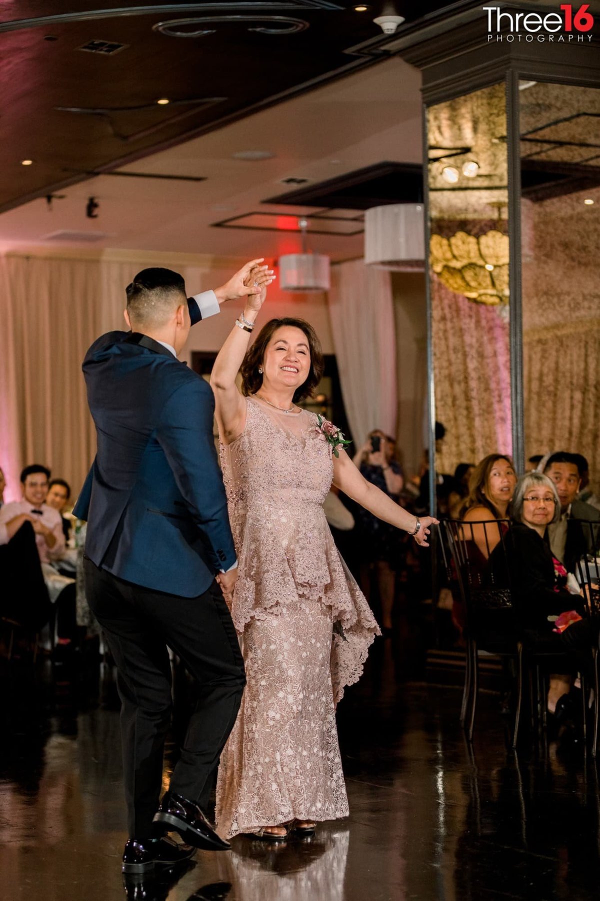 Groom dances with his mother at his wedding