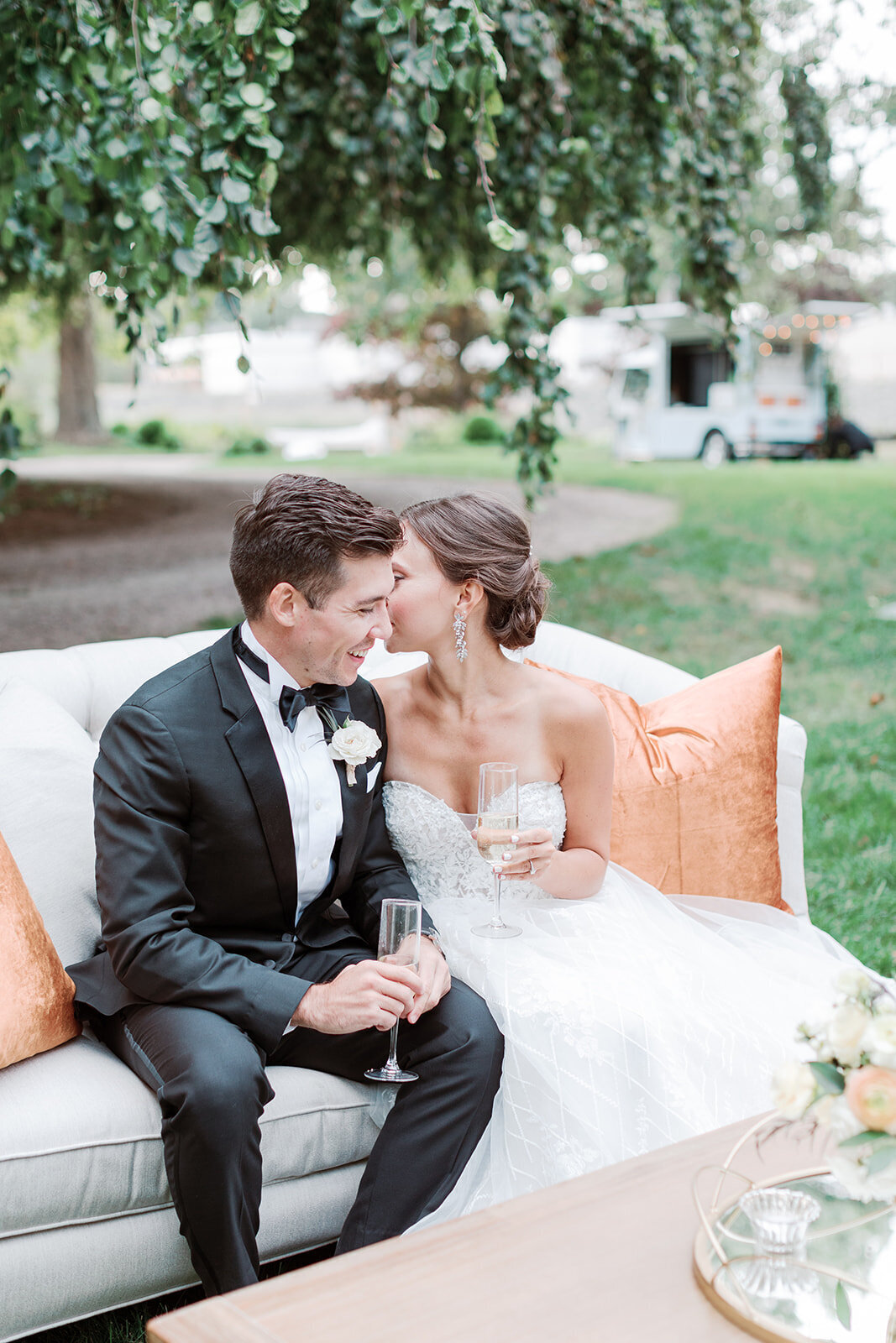 Bride whispers to groom lounging on Connecticut estate law