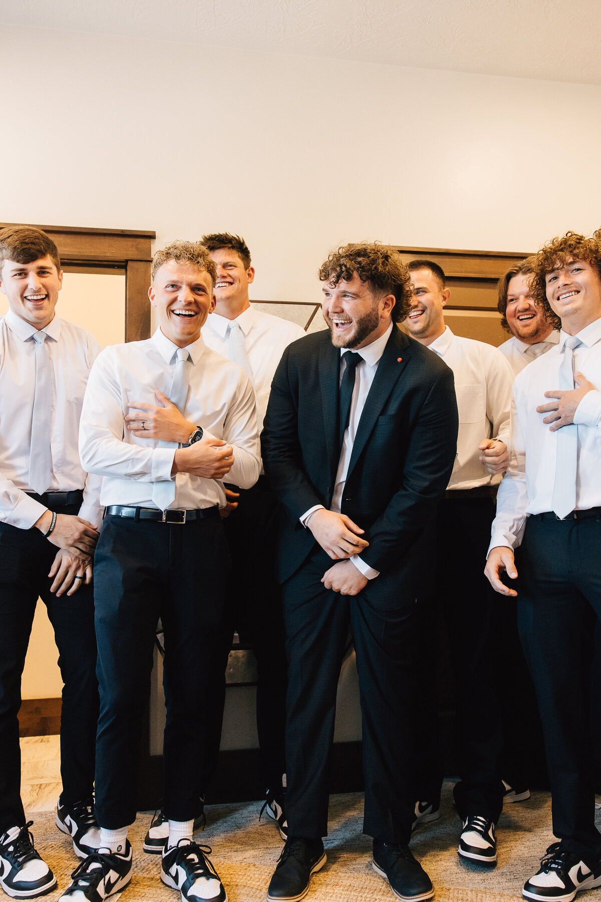 Groomsmen laughing together