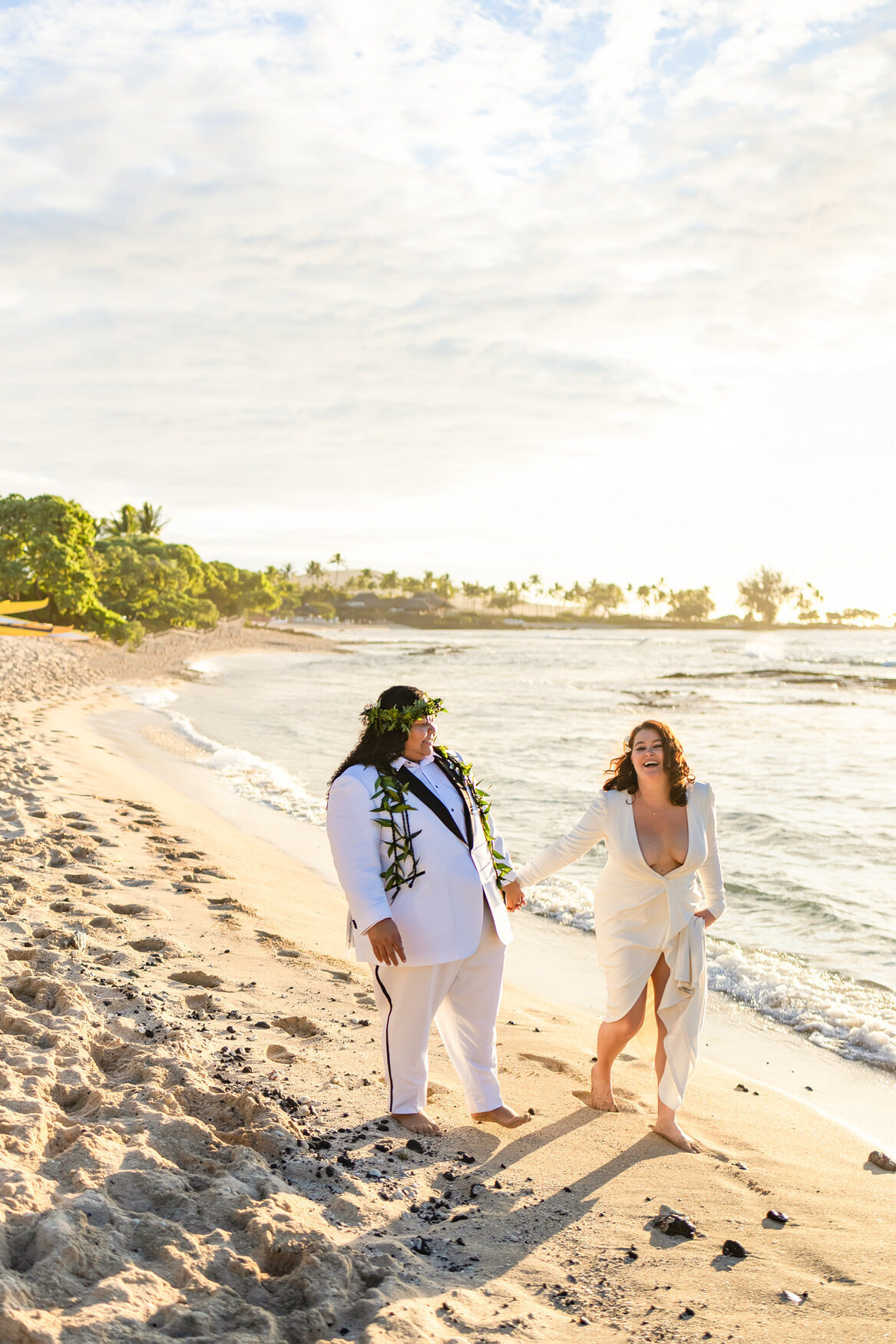 brides walking down the beach