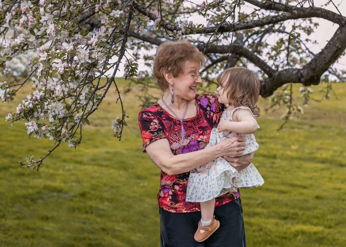 grandmother and granddaughter pose for a portrait at topsmeade state forest in Litchfield Connecticut