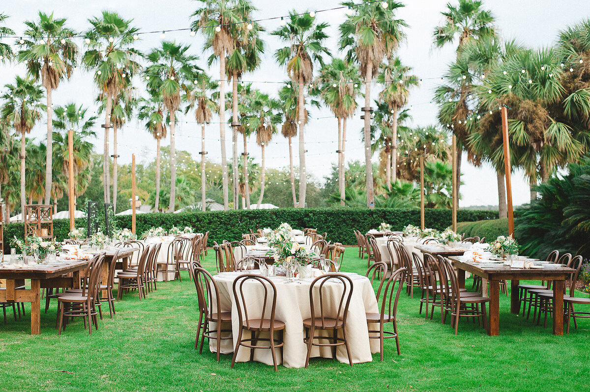Wedding reception at sea island with tables and chairs set.