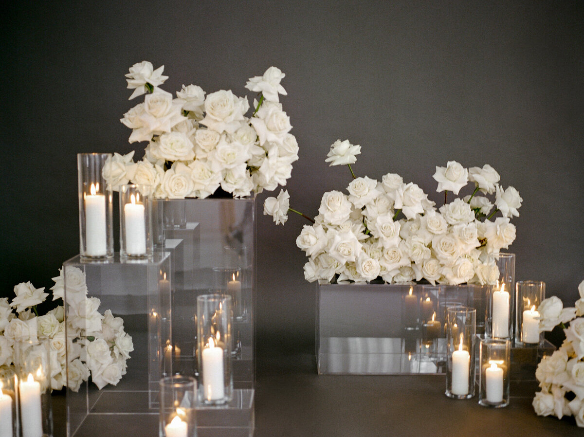 abundant blush roses with candles, dark background, florist brand photos in Detroit, Michigan