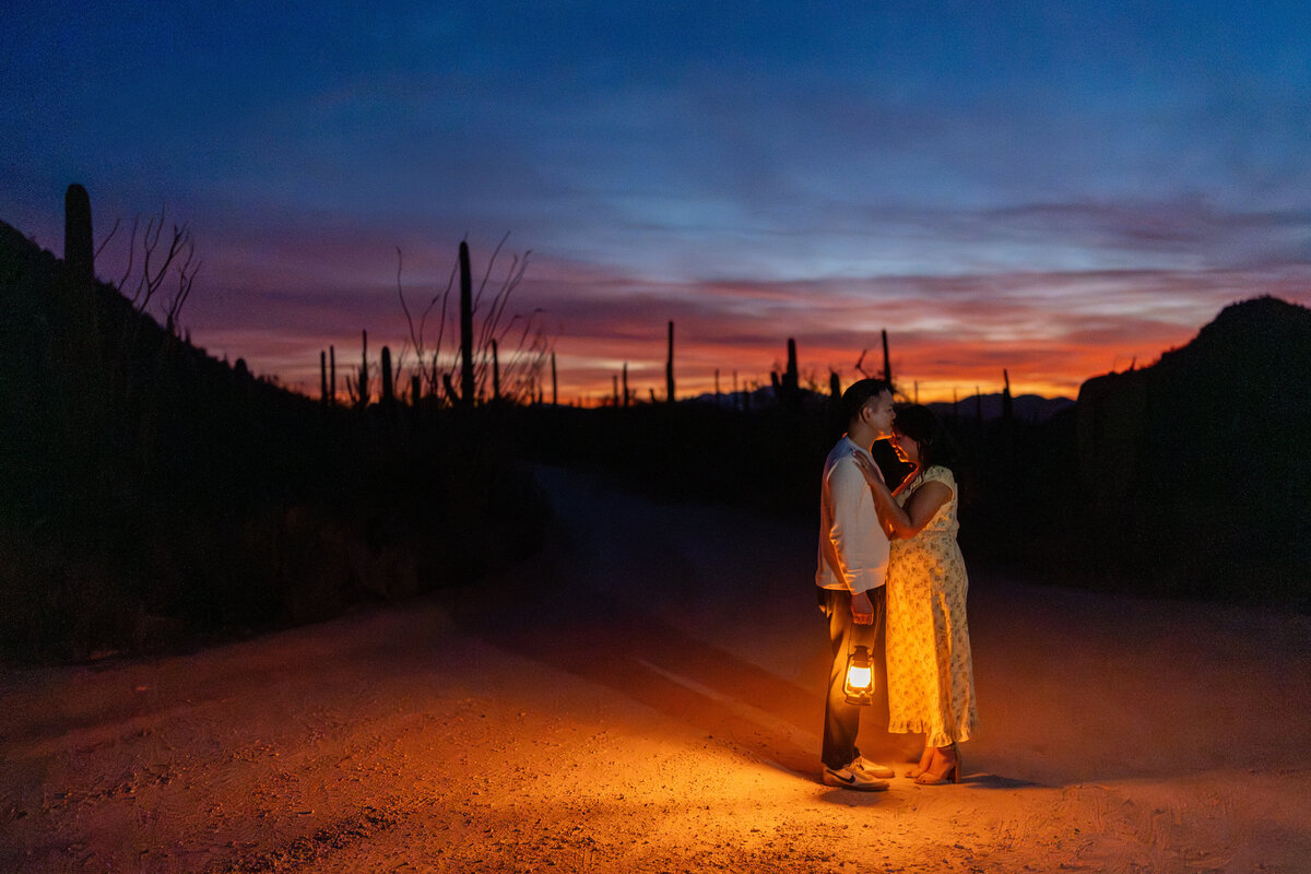 Tucson Saguaro Arizona Elopement with Bride Groom during Vibrant Sunset Blue Hour at Night holding lanterns.