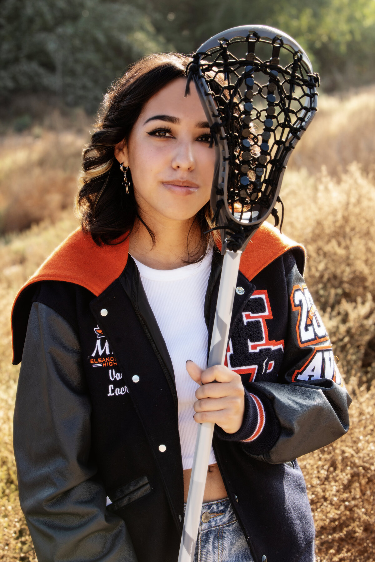 senior portrait with lacrosse