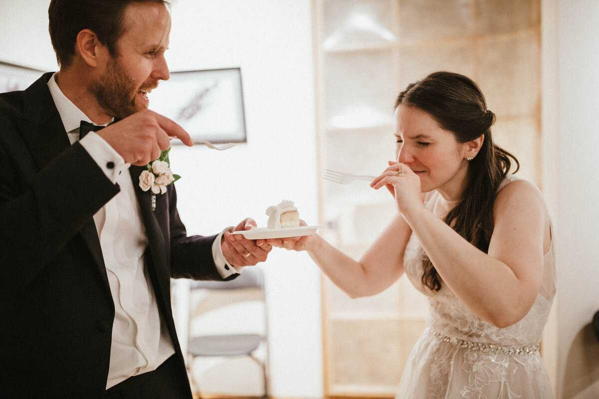 newly-wed-couple-eating-cake
