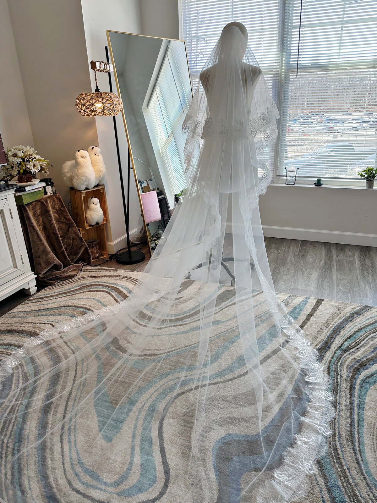 Romantic lace-edge blusher veil glowing in sunlight
