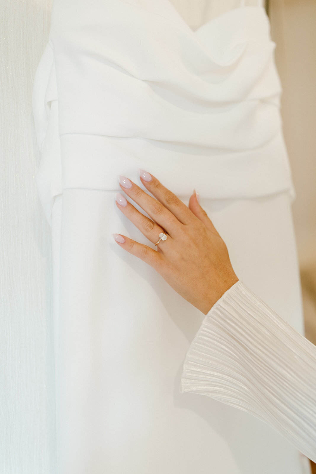 bride-touching-wedding-dress-connecticut-wedding-planner
