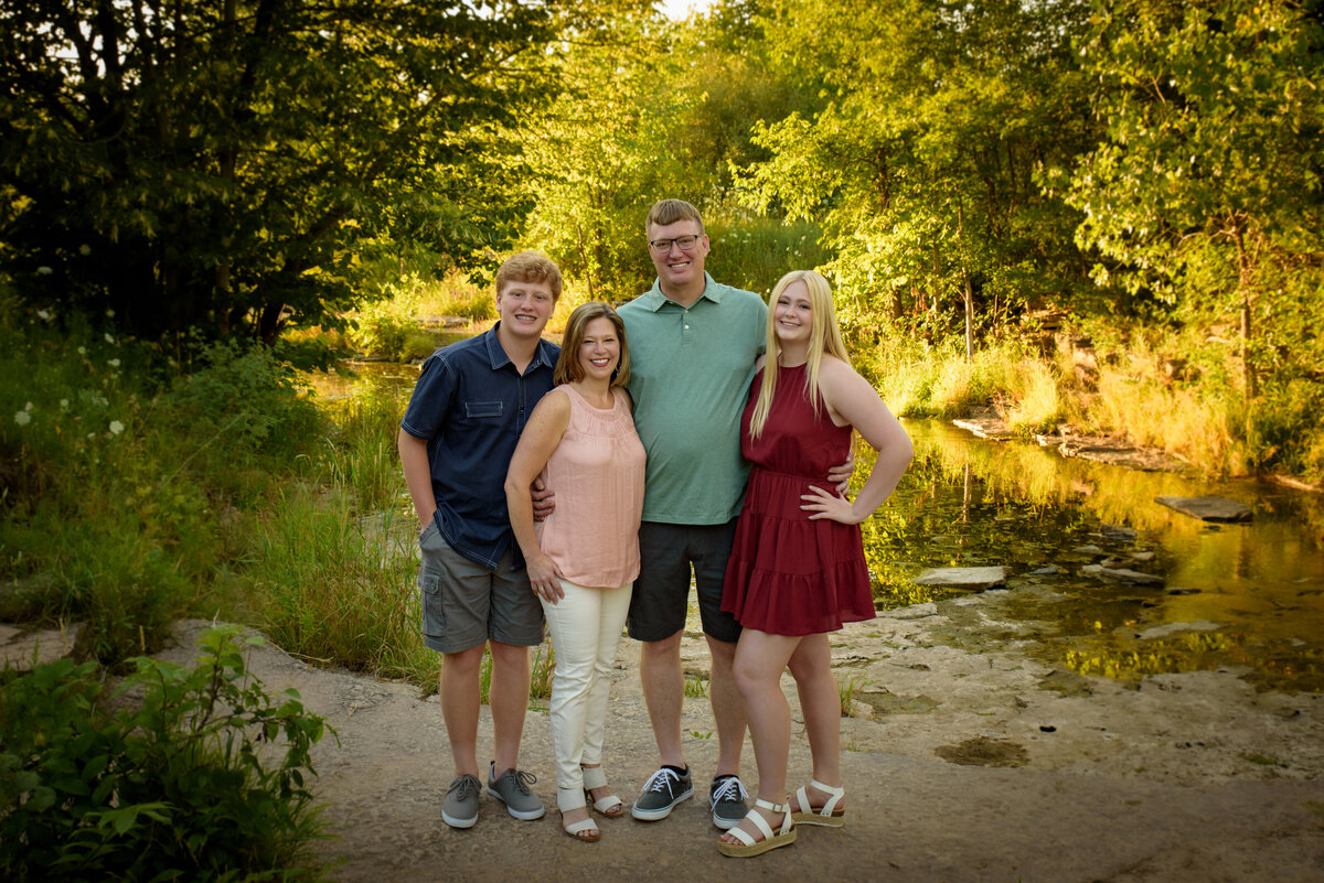 Portrait with a family including two teenage kids near the creek at Fonferek Glen County Park near Green Bay, Wisconsin