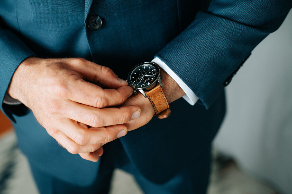 close up of groom's watch blue suit martha's vineyard wedding