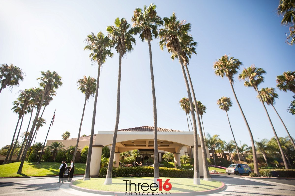 Large palm trees in front of the entrance at the SeaCliff Country Club in Huntington Beach