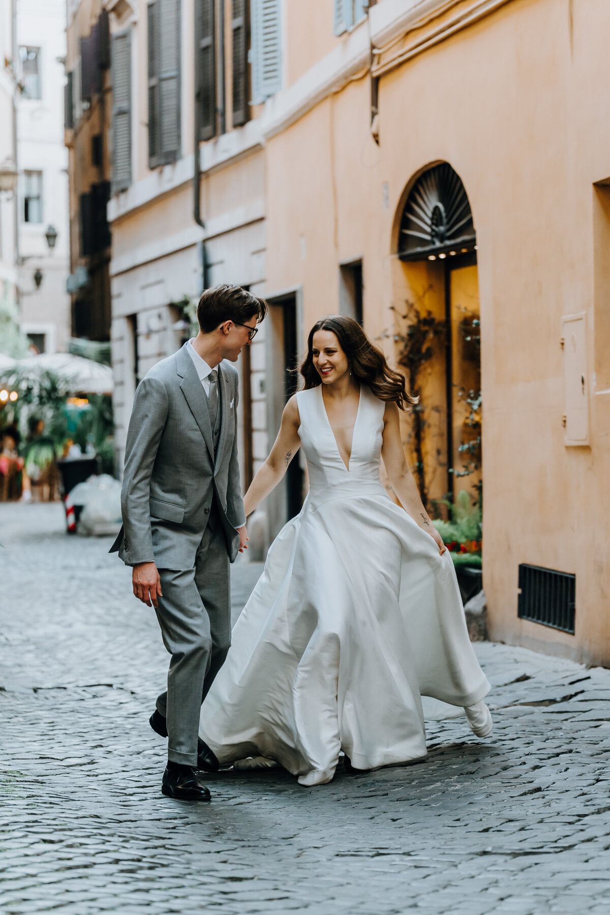 Intimate moment in a narrow Rome alleyway.