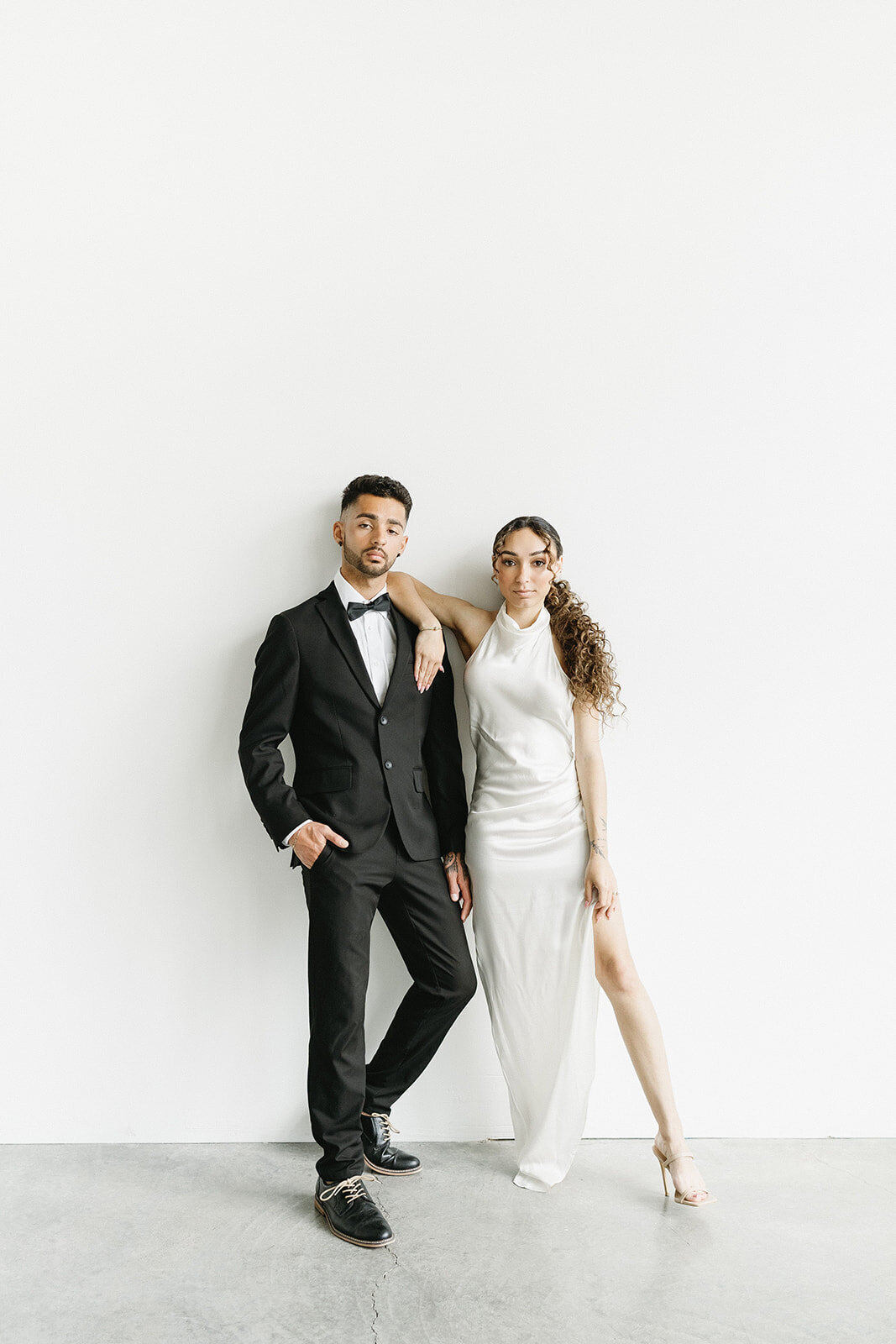 bride and groom posing for the camera