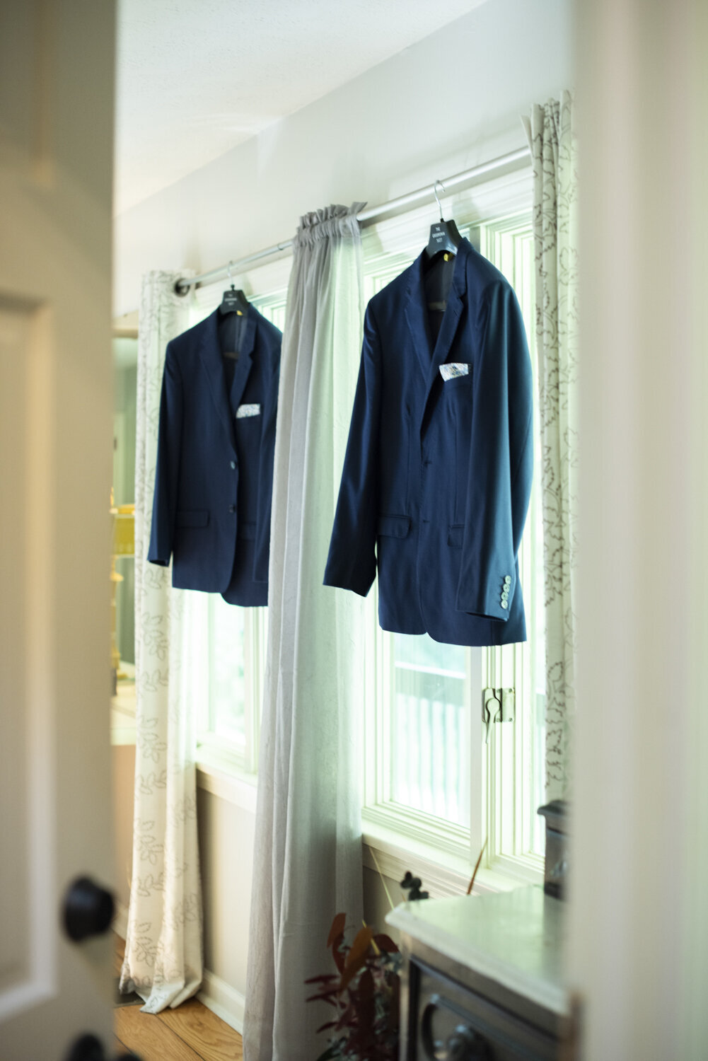 Grooms suits hanging