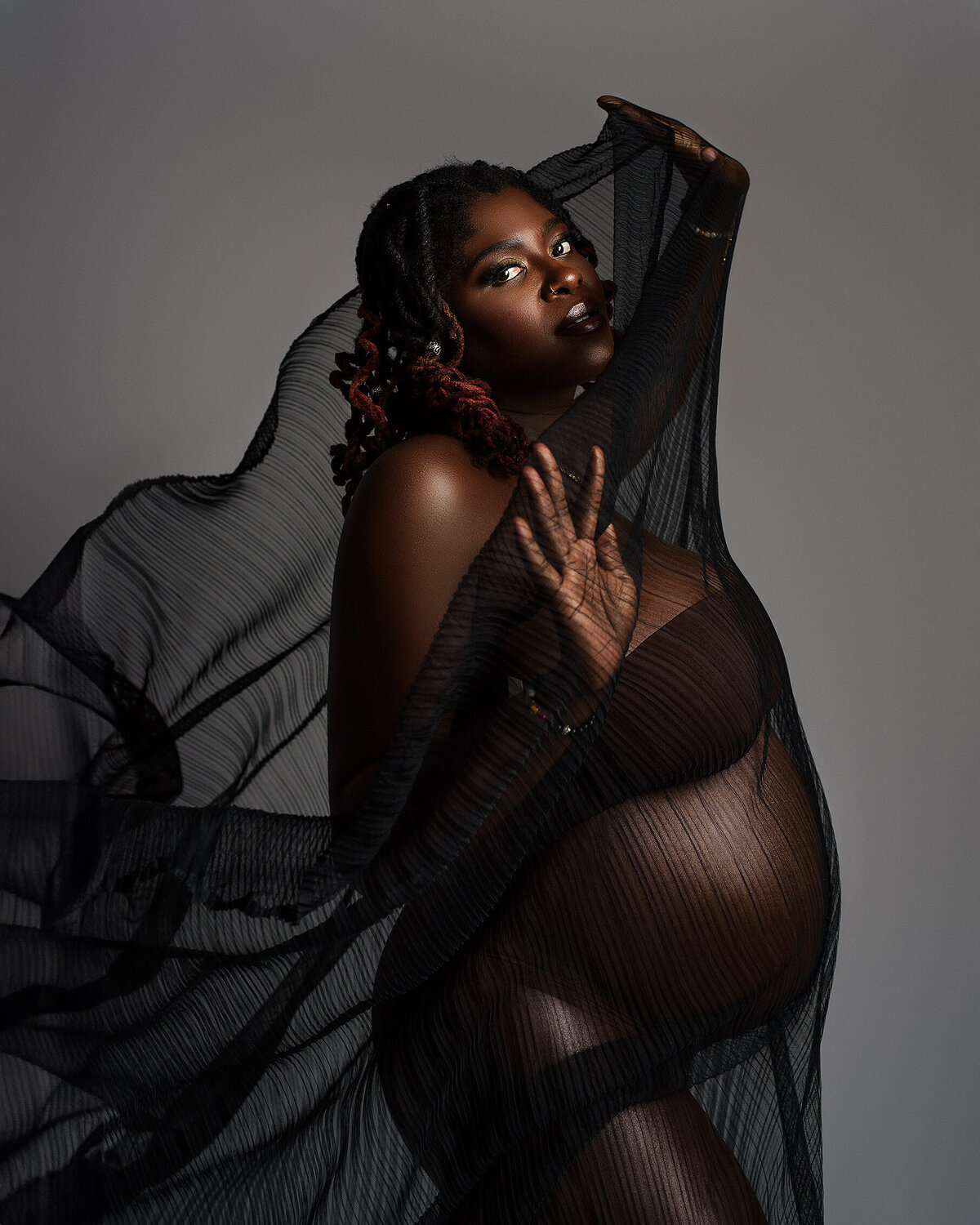 Black Fabric flowing around maternity mama