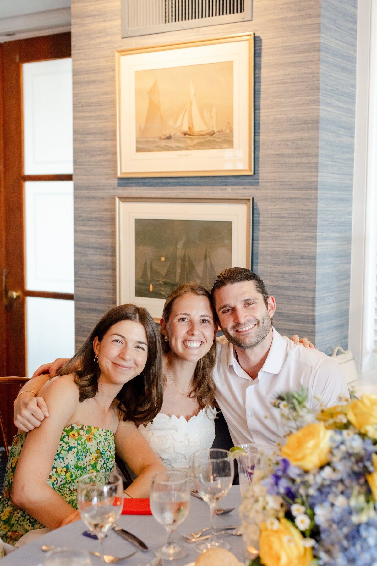 couple and bride smiling at rehearsal dinner at American Yacht Club in Rye, NY 