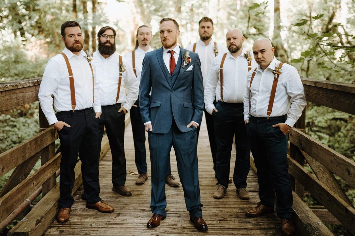 Groomsmen and groom wear their boutonnieres by Flowers and Thyme.