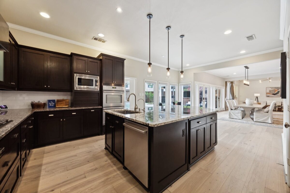 17828_cedar_creek_canyon_dr_dallas_tx_kitchen_with_granite_island_open_to_dining_-_haven_realty_group