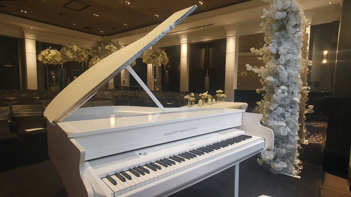 white baby grand piano wedding ceremony