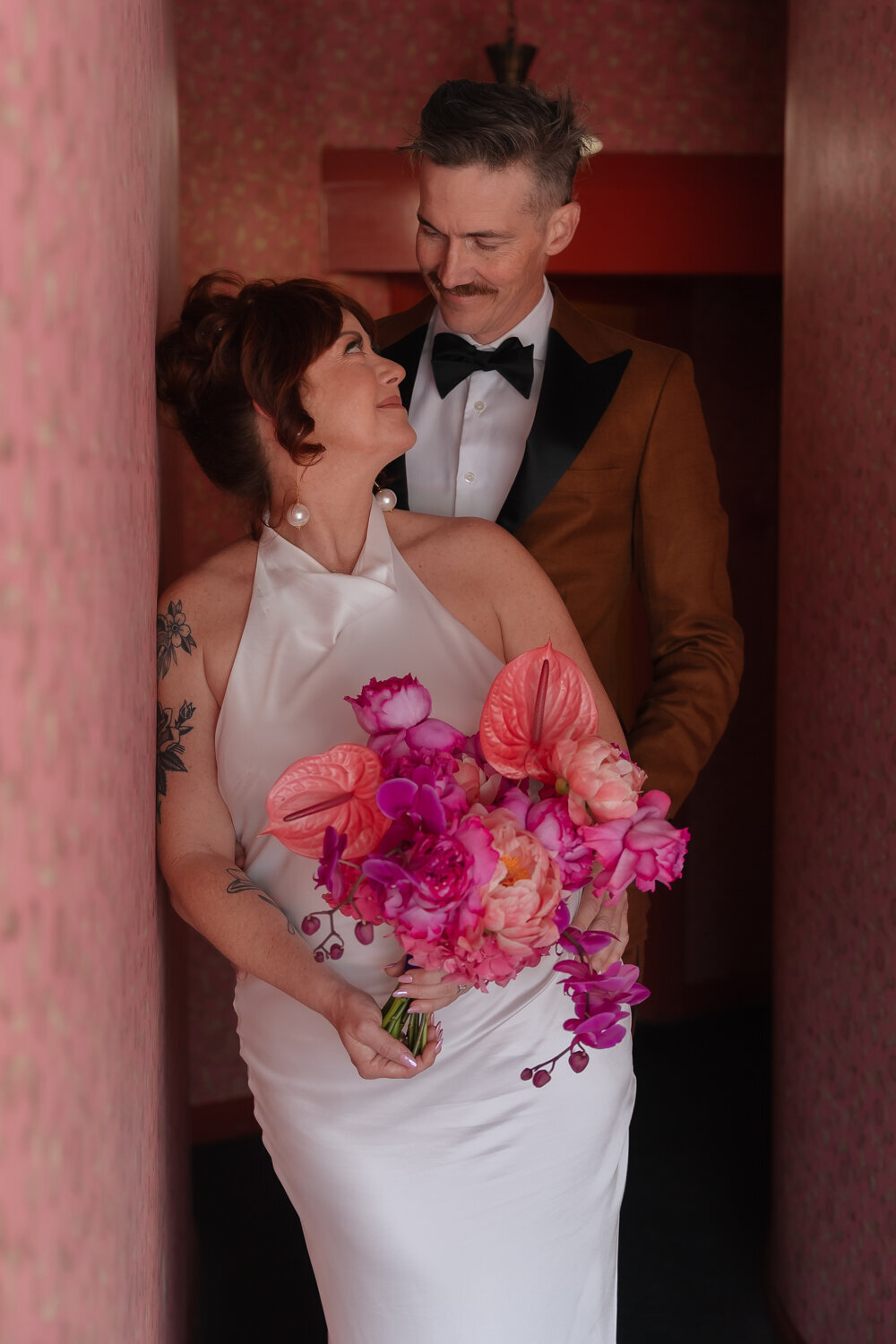 Madonna Inn wedding couples photos with colorful flower bouquet in San Luis Obispo