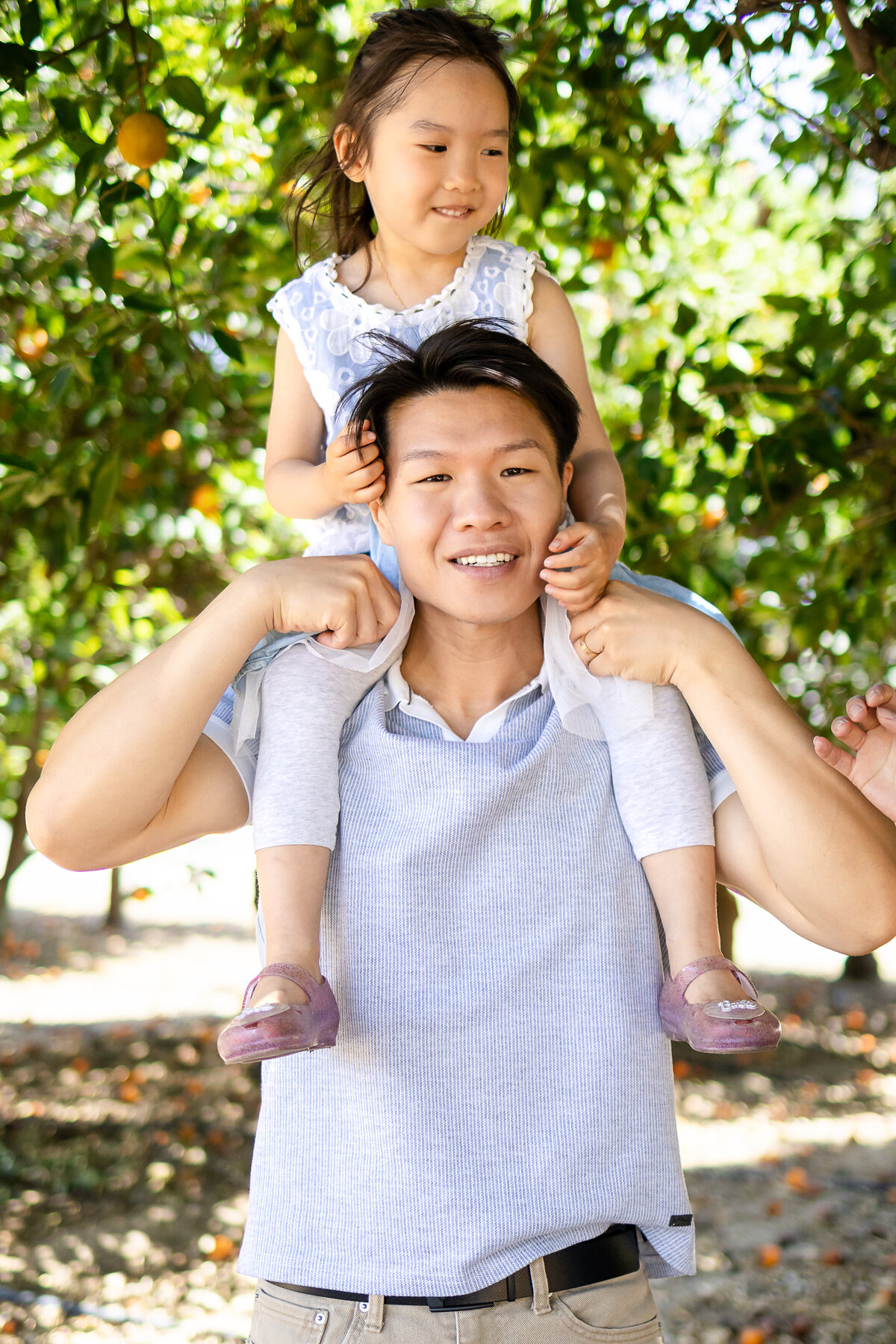 Father and two daughters children during a playful outdoor session – lifestyle family photography by Ellobelle Photography, San Francisco Peninsula