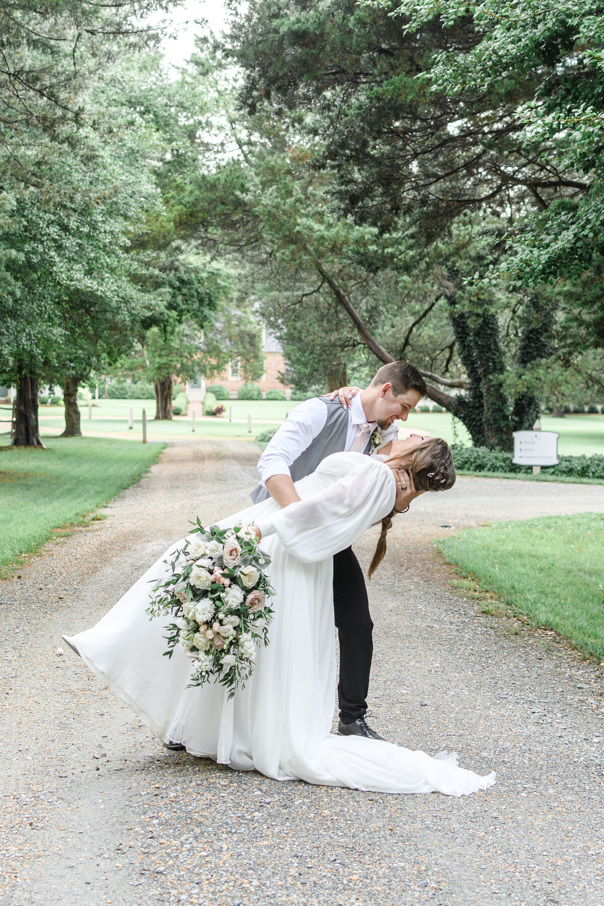 Ashley Hall Photography couple in a dramatic dip at Seven Springs in Manquin, VA