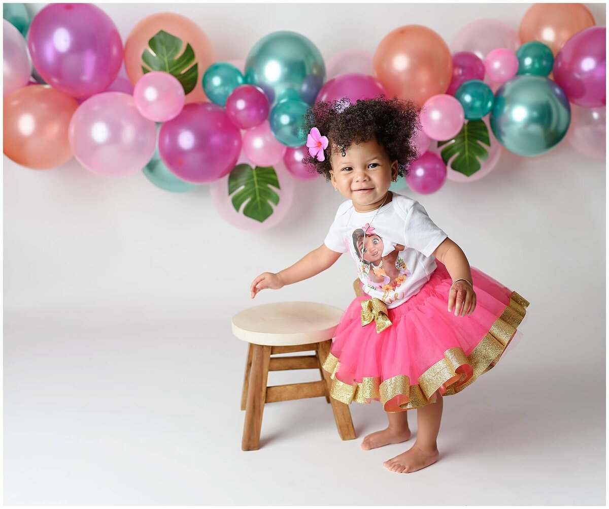 A sweet and candid studio portrait of a toddler, showcasing their natural beauty and innocence.