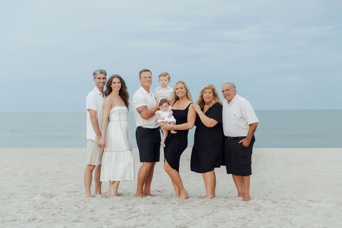 Family Portraits | Family walking along the shoreline during a summer beach session | Lavallette, New Jersey
