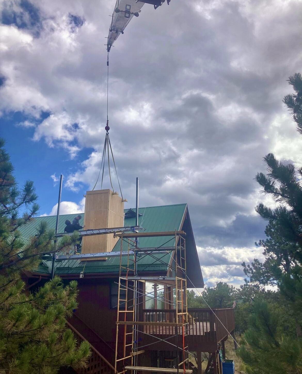 Chimney installation by Mountainside crane service for Foothills and Mountain communities