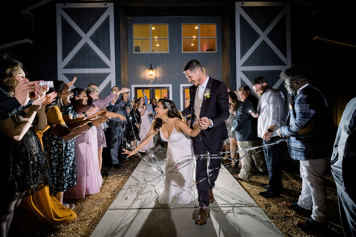 grant-hill-farms-wedding-sparkler-exit-bride-laughing