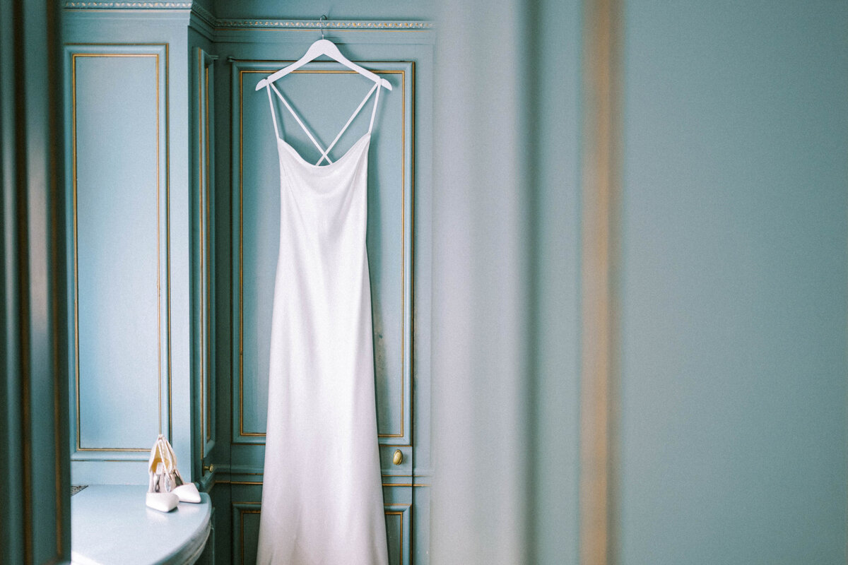 dress-hanging-on-blue-wall