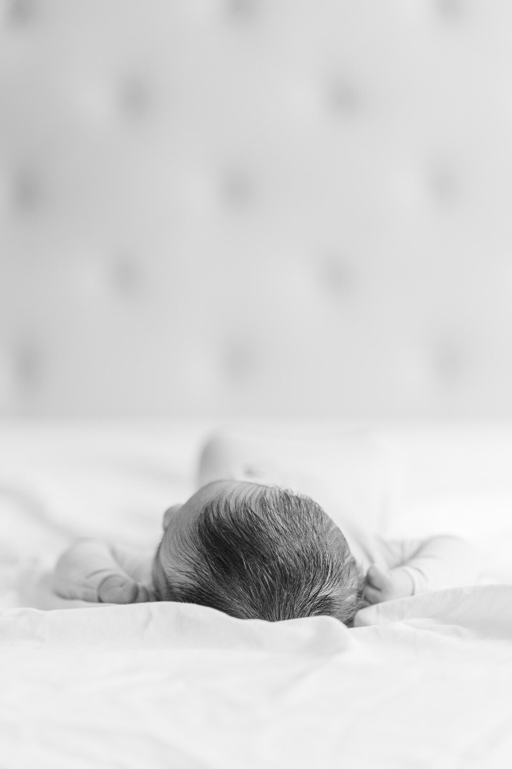 baby boy sleeping during  lifestyle newborn photography in Gainesville, Virginia