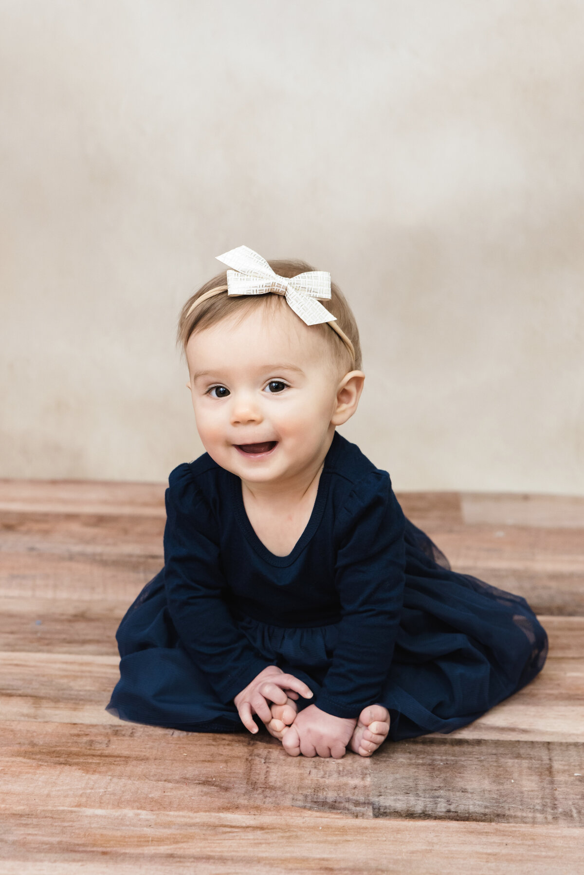 6 month old girl poses for her pictures