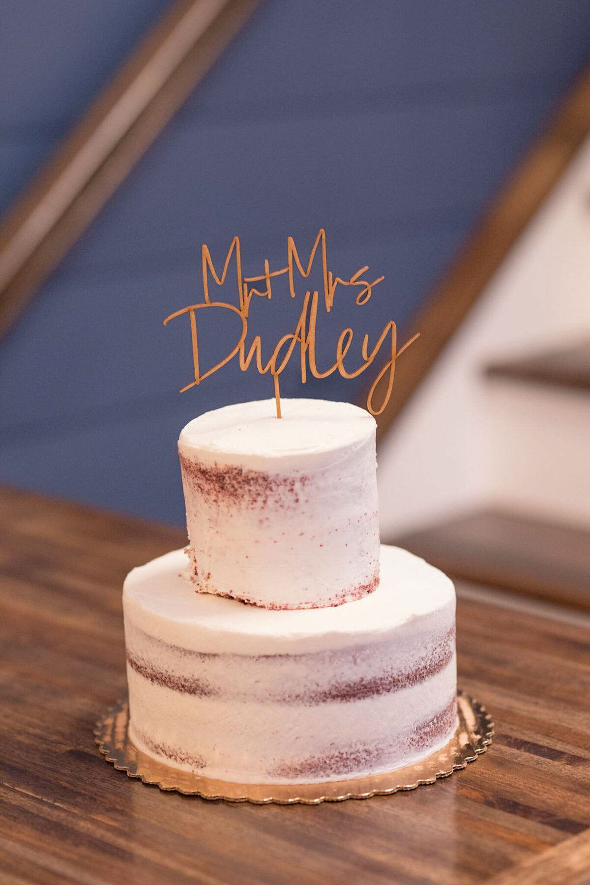 A close up of the wedding cake, with a Mr & Mrs Dudley topper