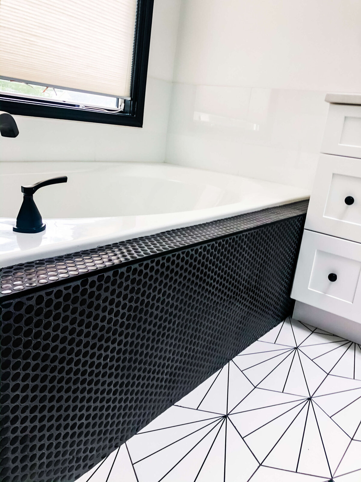 black-penny-tile-soaking-bathtub