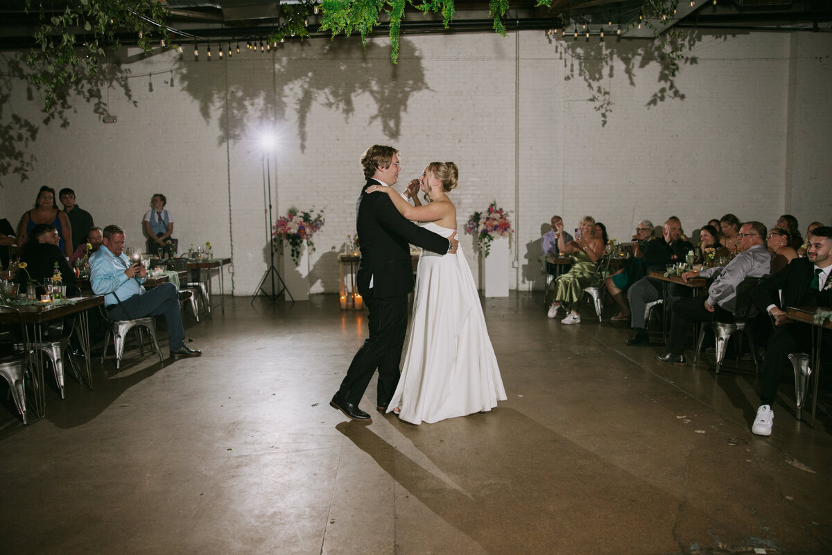 A bride and groom have their first dance at Skylight in Denver, Colorado.