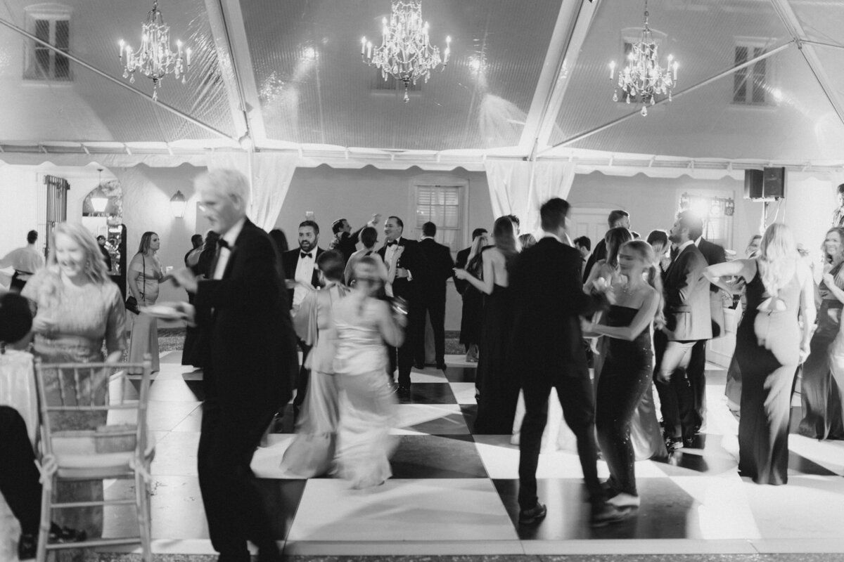 Motion blur black and white dance floor photo. William Aiken House wedding reception. Kailee DiMeglio photography.