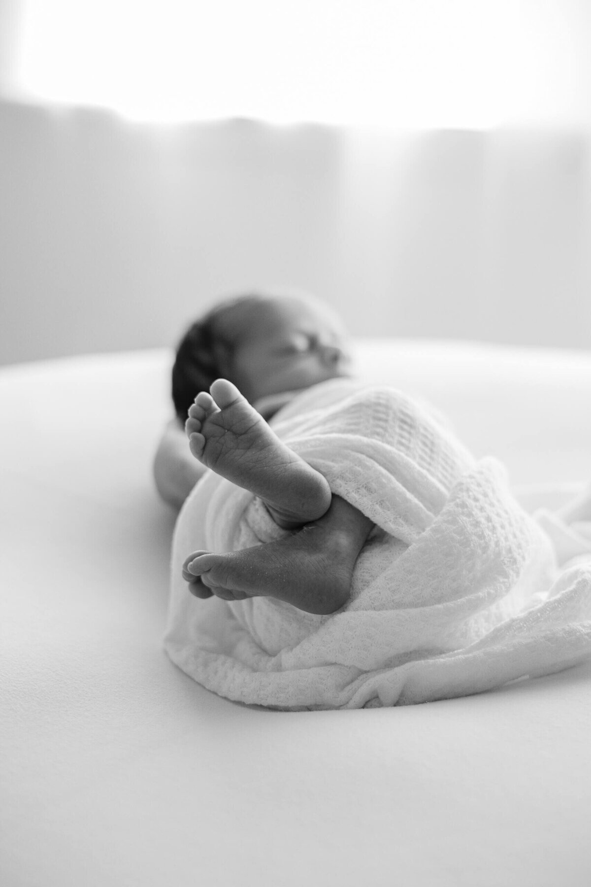 a close up of a newborn baby's feet