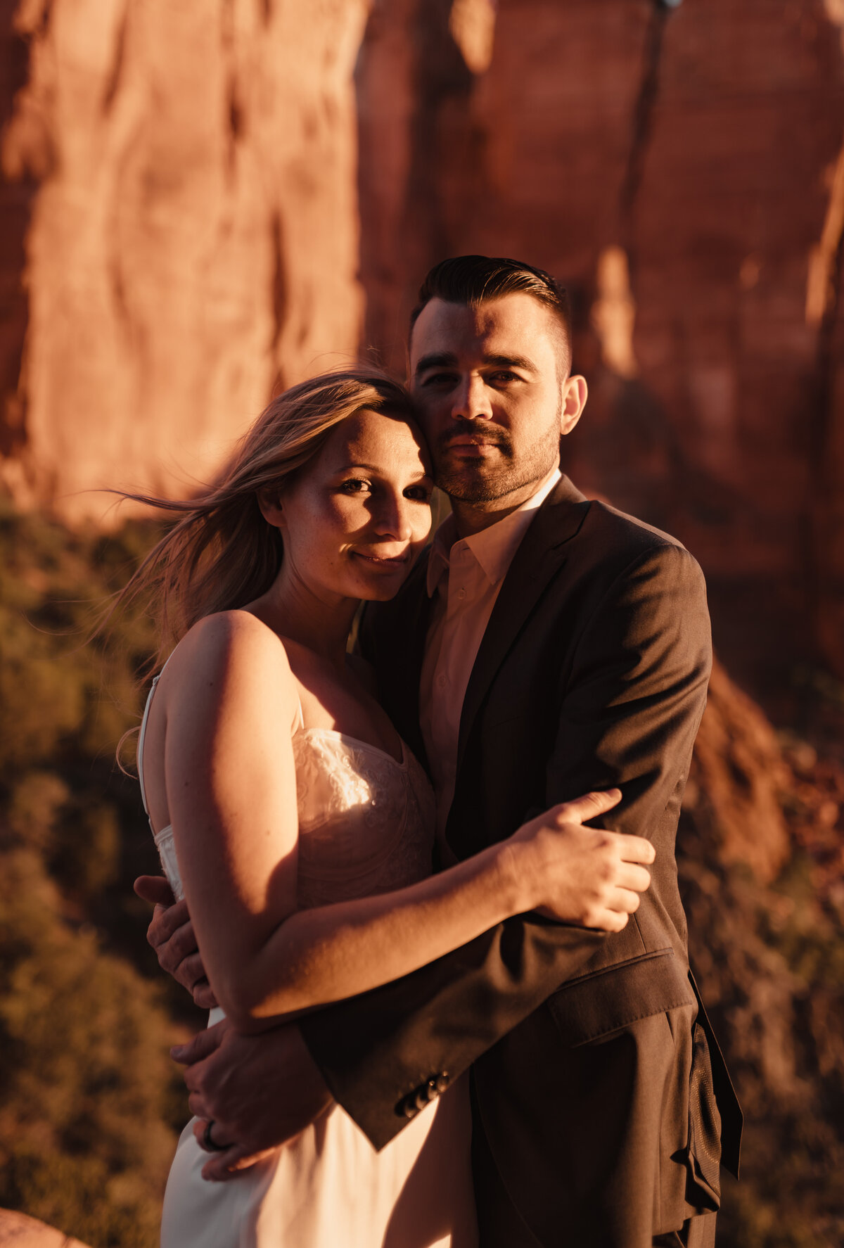 Couple holding hands during Sedona elopement at Cathedral Rock taken by Kollar Photography