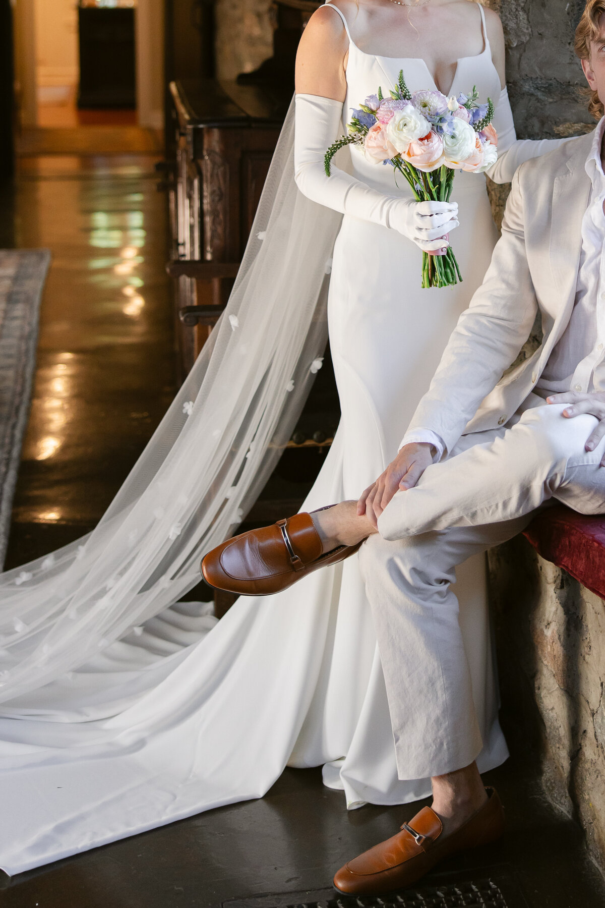 bride-and-groom-sitting-portrait-at-saint-clements-castle