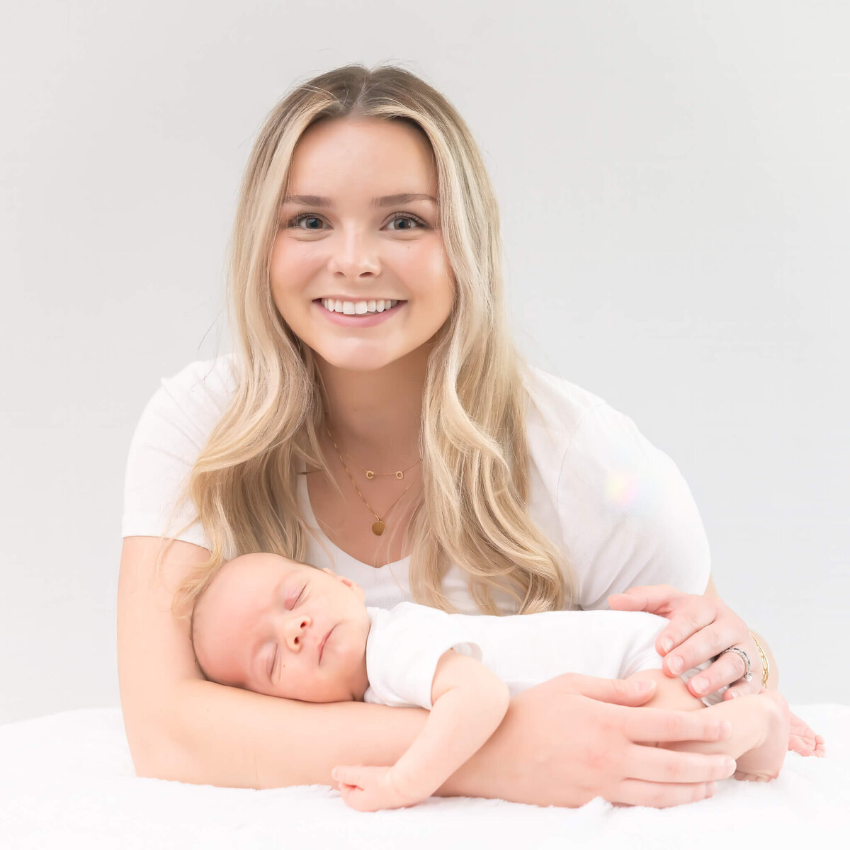beautiful new mom and baby in a light bright timelss studio session