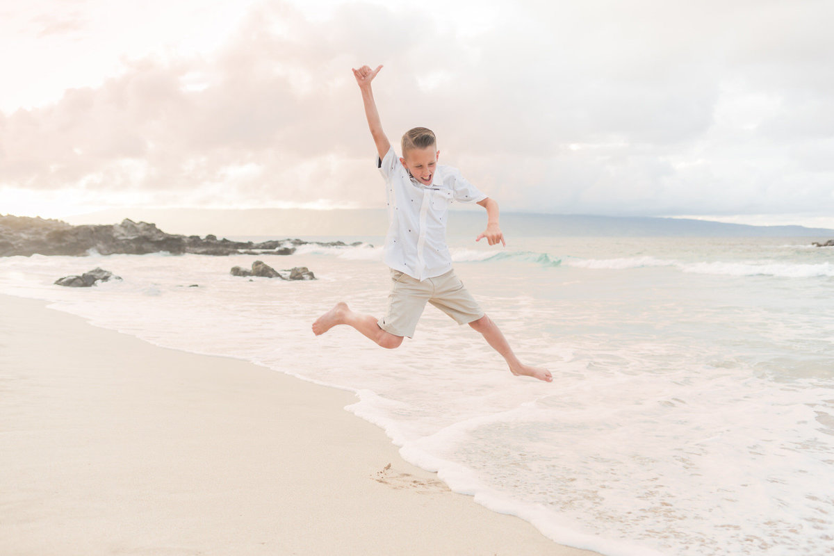 boy jumping Maui family photography