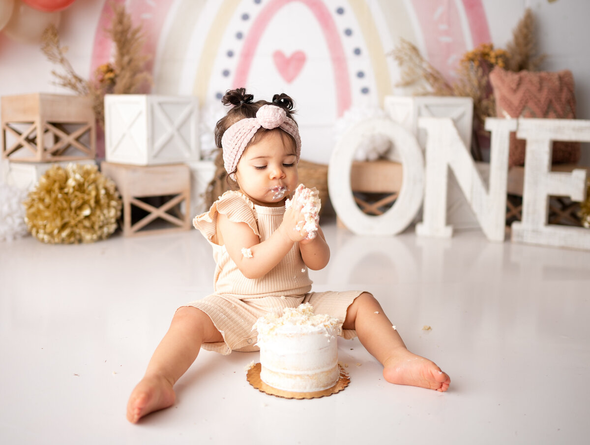 pink and neutral boho rainbow cake smash