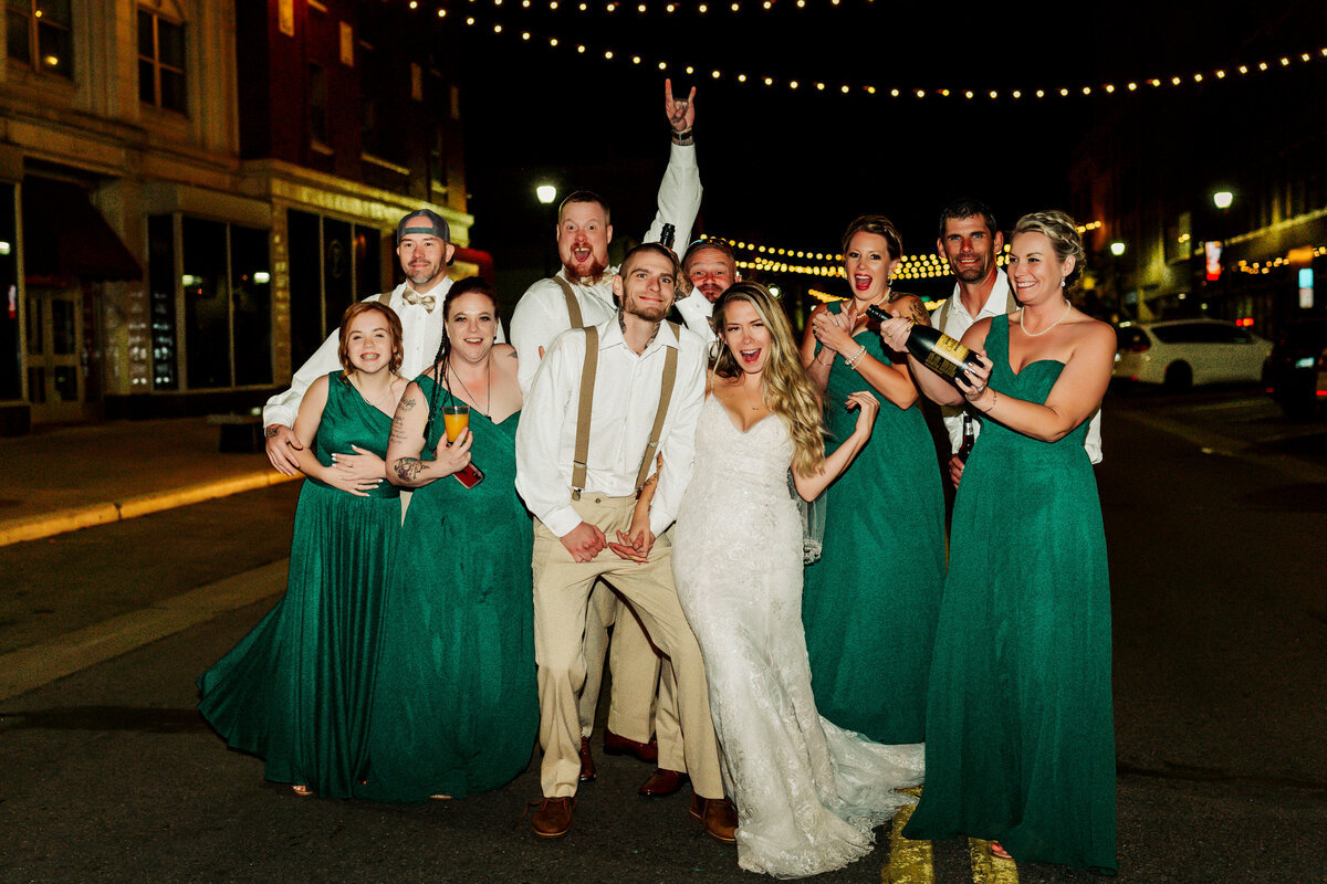 wedding party cheering at night in St. Cloud, Minnesota