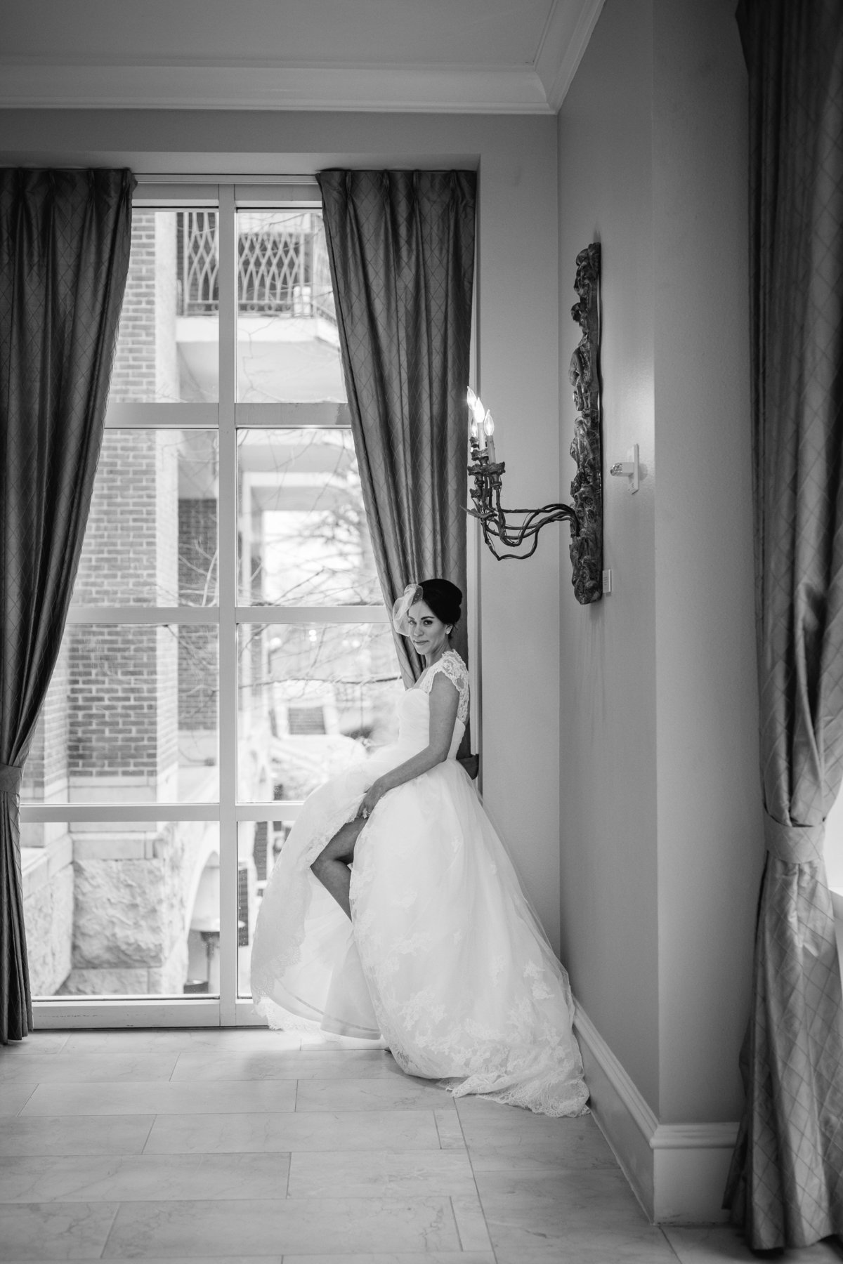 bride showing leg off at the The St. Anthony hotel wedding venue, a Luxury Collection Hotel in San Antonio